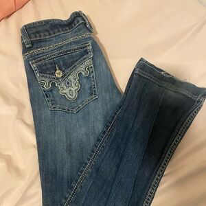 Blue bootcut jeans; low waisted